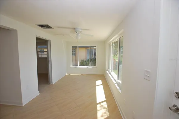 a view of an empty room with a window
