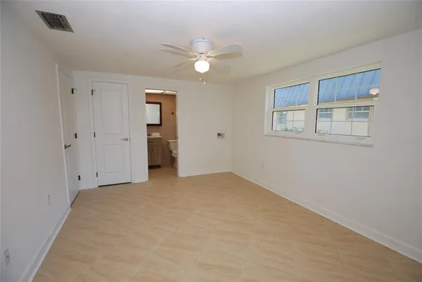 a view of an empty room with a window