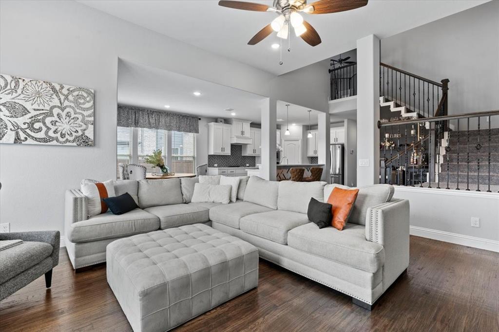 620 Shadow Trail Frisco, TX 75033 - Photo 14 of 36 Spacious living area featuring high ceilings, wood-finish flooring, and an open concept layout