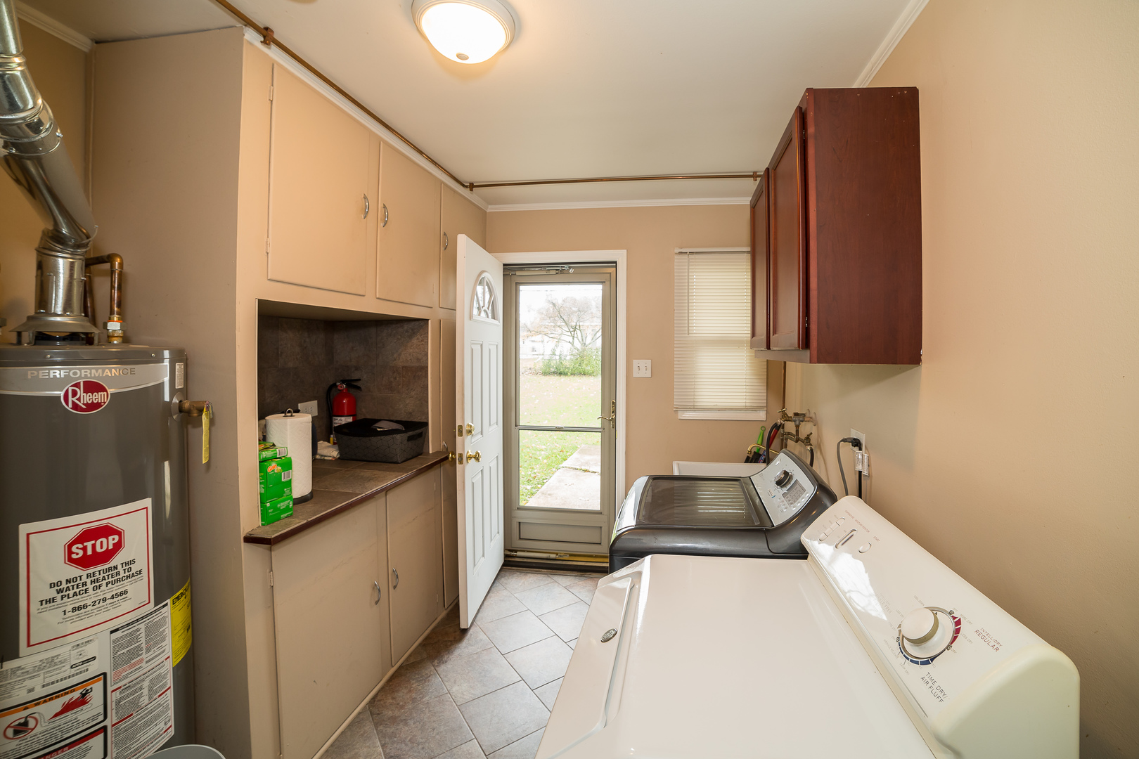 166 Monee Road Park Forest, IL 60466 - Photo 8 of 12 a kitchen with sink refrigerator and window