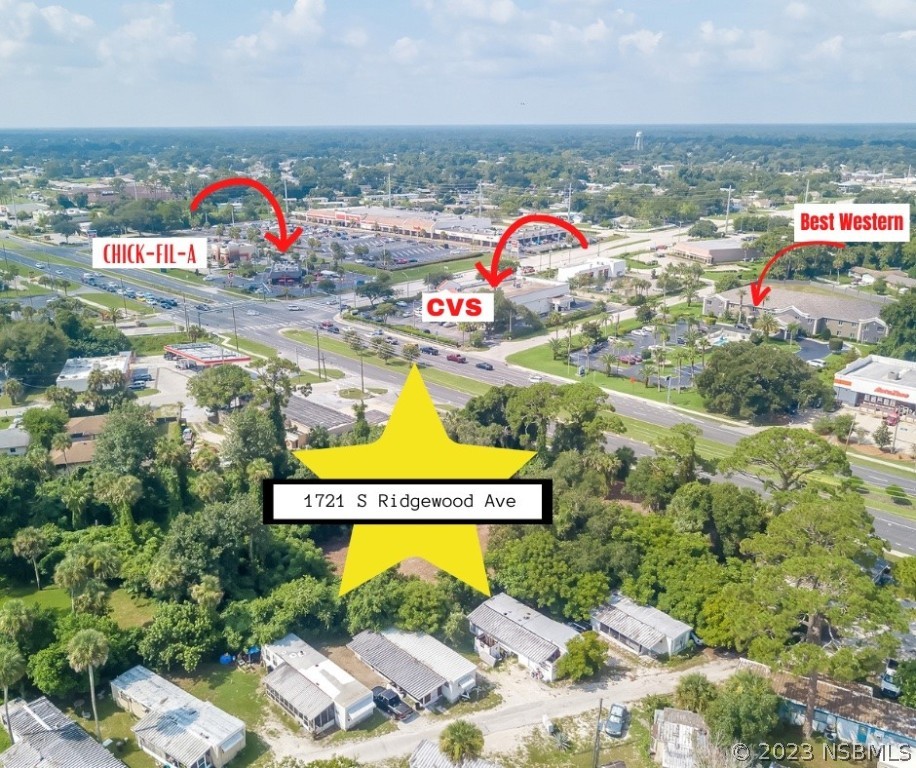 an aerial view of swimming pool patio and mountain view