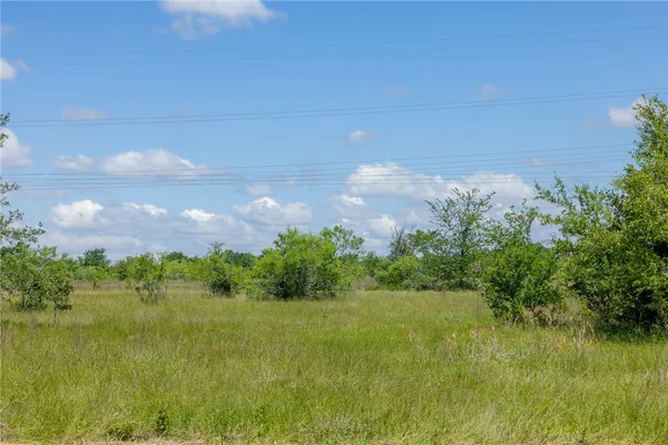a view of a lake with a yard