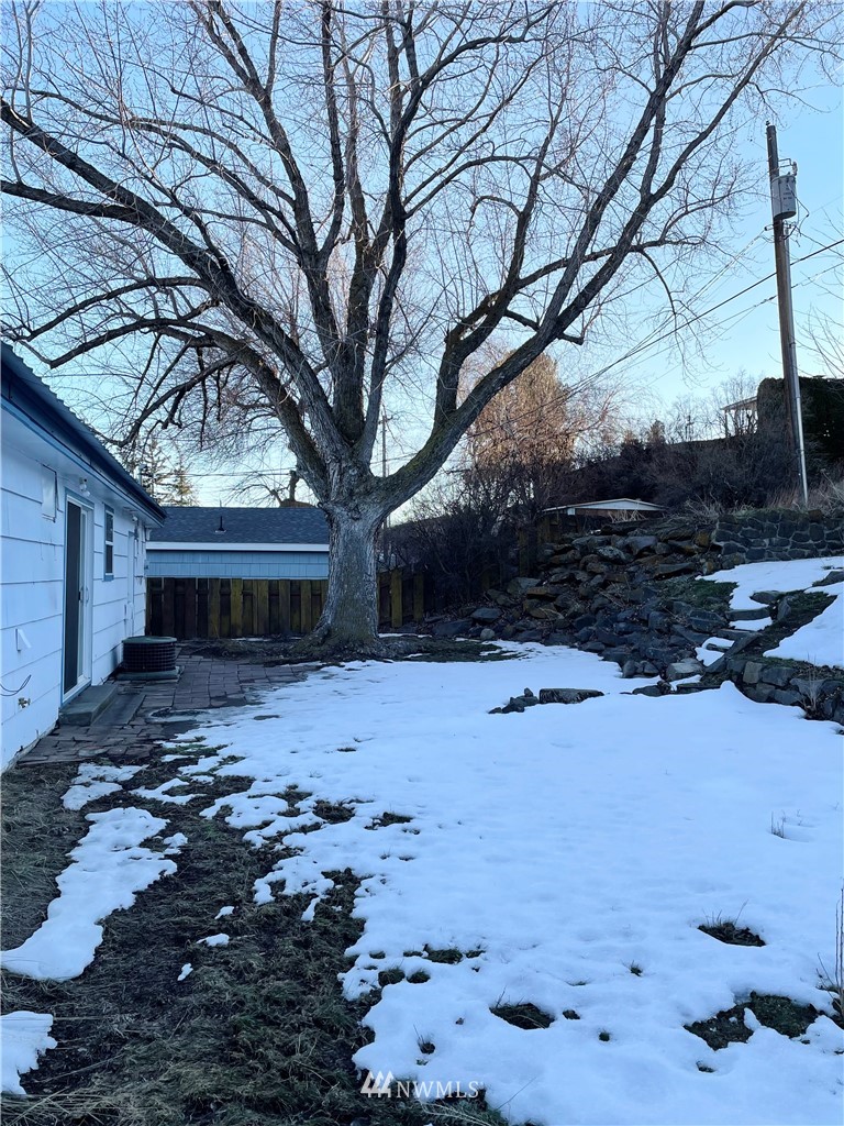 381 Patrick Road Ephrata, WA 98823 - Photo 25 of 32 a view of a yard covered with snow in the backyard
