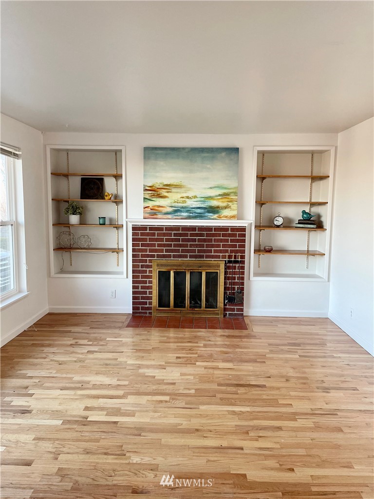381 Patrick Road Ephrata, WA 98823 - Photo 6 of 32 a view of an empty room with a fireplace and a window