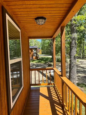 a view of a street with a tree