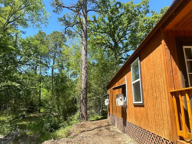 a kitchen with a refrigerator cabinets and wooden floor