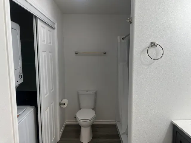 a bathroom with a glass shower door