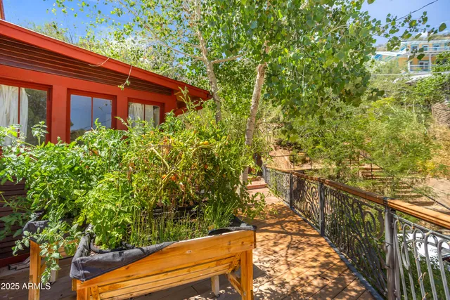 a view of a balcony with wooden fence and floor