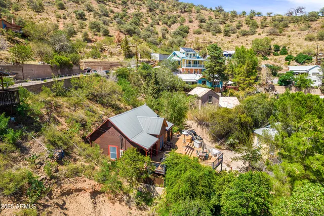 an aerial view of residential houses with outdoor space