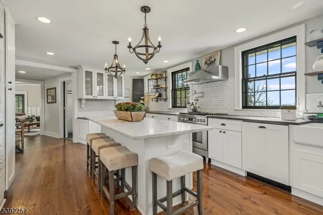 a large kitchen with a table and chairs