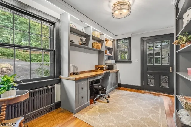 a view of dining room with furniture and wooden floor