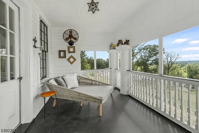 a view of a porch with furniture