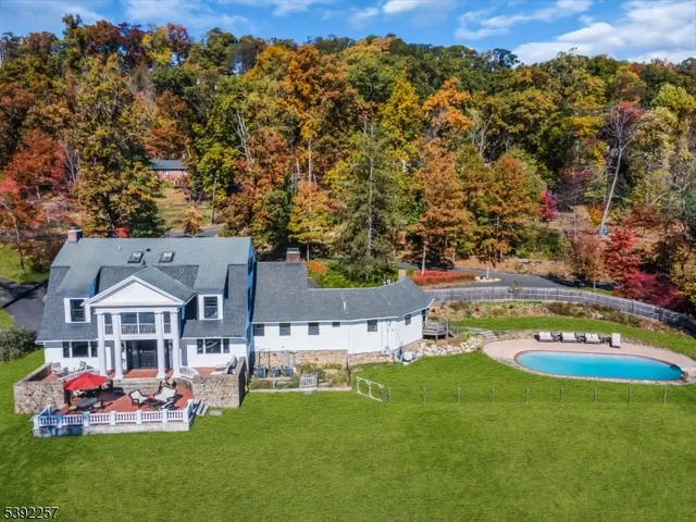 a view of a patio with a dining table and chairs