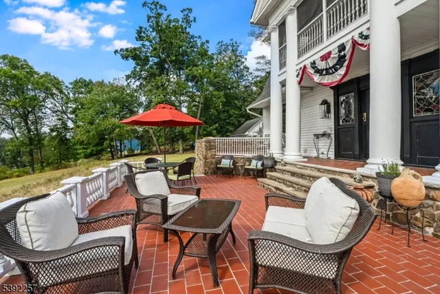a patio with tables and chairs