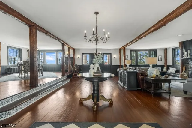 a view of entryway with wooden floor and stairs