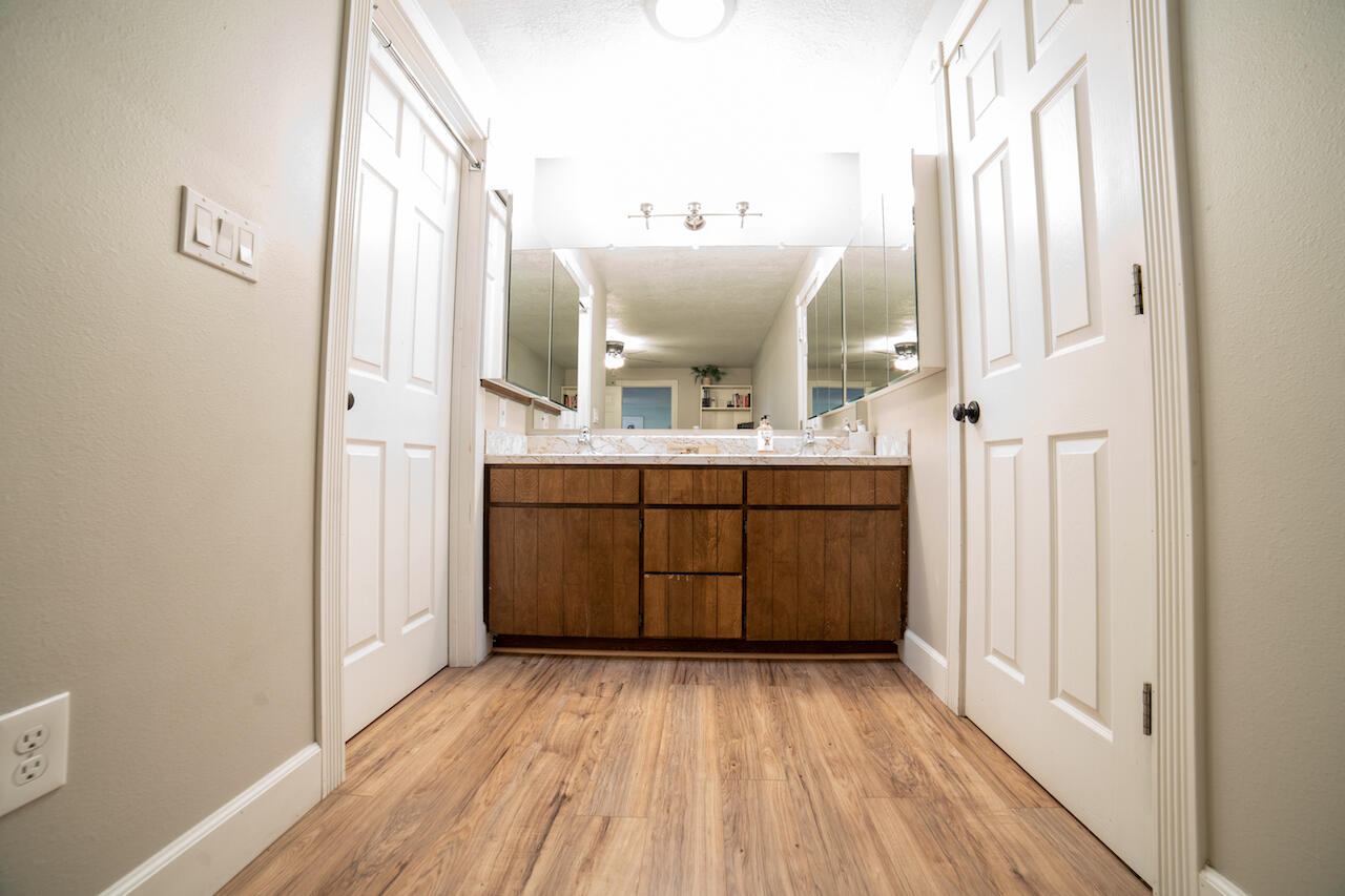 63410 Hamehook Road Bend, OR 97701 - Photo 20 of 35 a bathroom with a sink mirror and window
