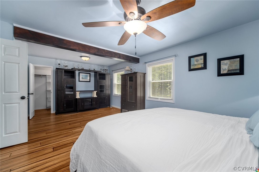 16001 Beach Road Chesterfield, VA 23838 - Photo 15 of 27 a spacious bedroom with a large bed a chandelier and closet