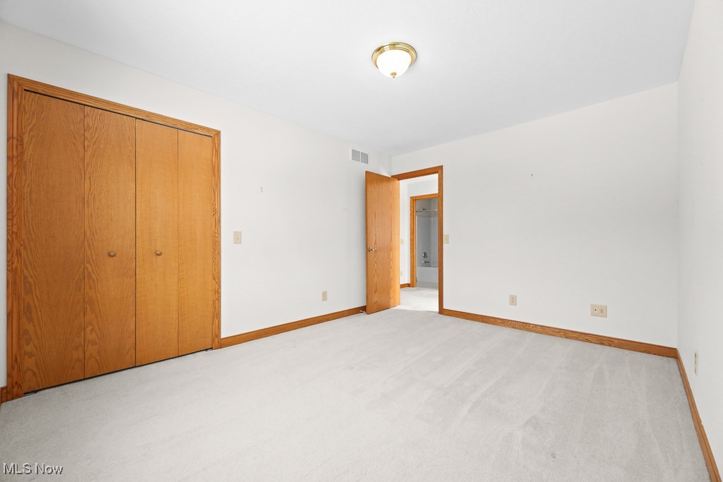 4808 Sherman Road Kent, OH 44240 - Photo 28 of 50 Unfurnished bedroom with light colored carpet and a closet