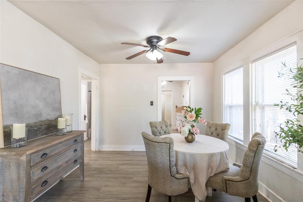 3349 South 3rd Street Abilene, TX 79605 - Photo 14 of 30 a dining room with furniture a chandelier and wooden floor