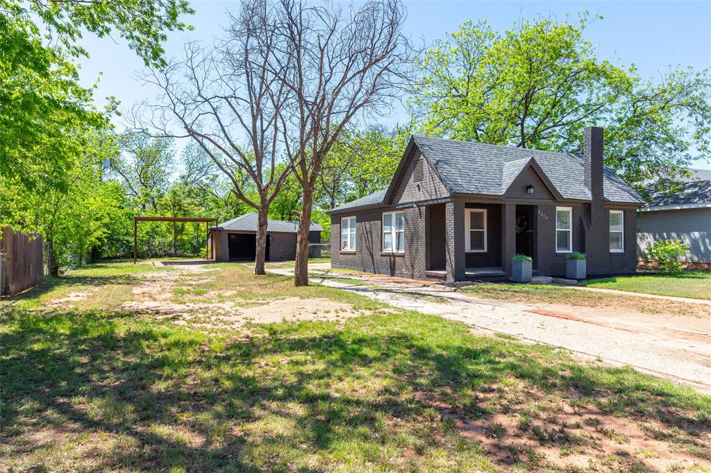 3349 South 3rd Street Abilene, TX 79605 - Photo 4 of 30 a front view of a house with a yard and trees