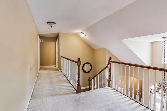 a view of a hallway with staircase