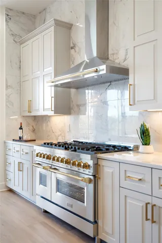 a bathroom with a granite countertop sink a mirror a vanity and a shower