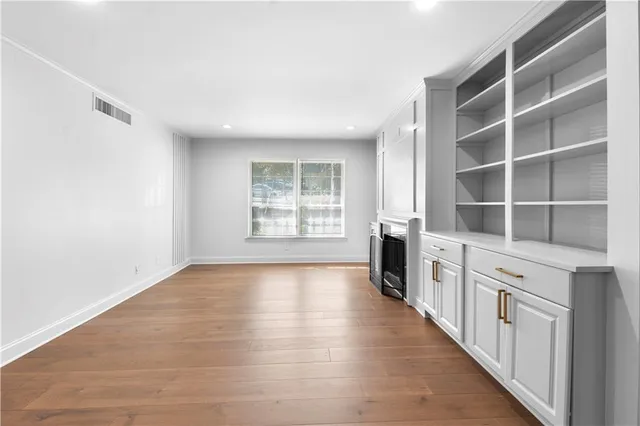 a view of a storage and utility room with washer and dryer
