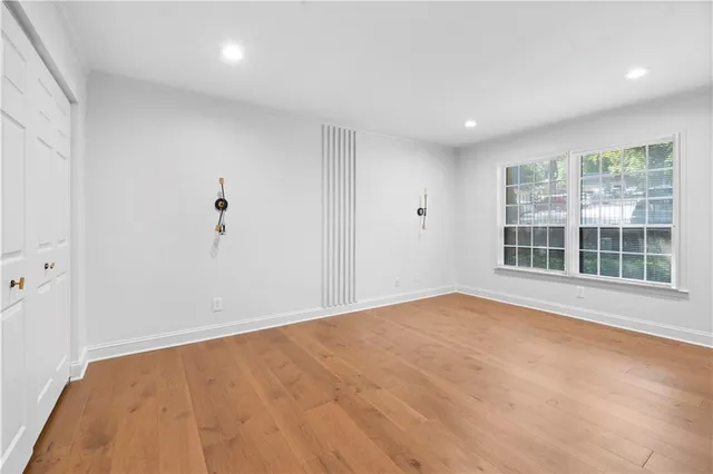a bathroom with a sink toilet a mirror and shower