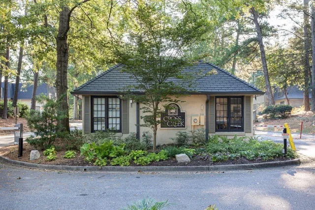 a view of sign board with garden