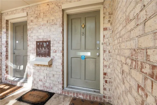 a kitchen with stainless steel appliances white cabinets and a sink