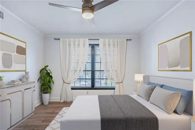 a bedroom with a bed and glass window