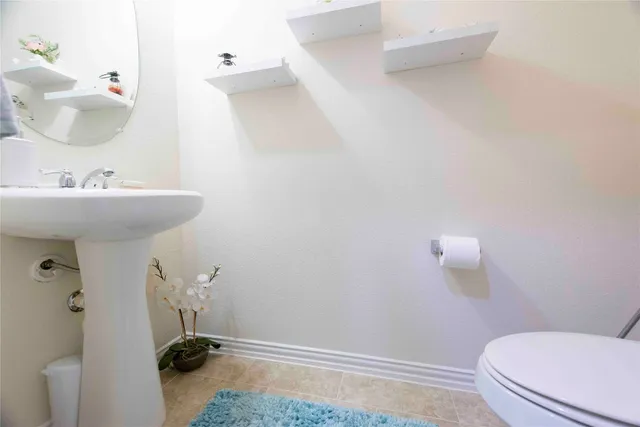 a bathroom with a sink and toilet