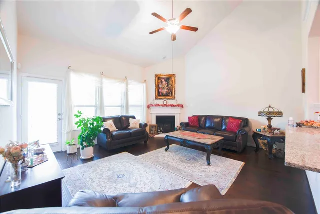 a living room with furniture and a fireplace