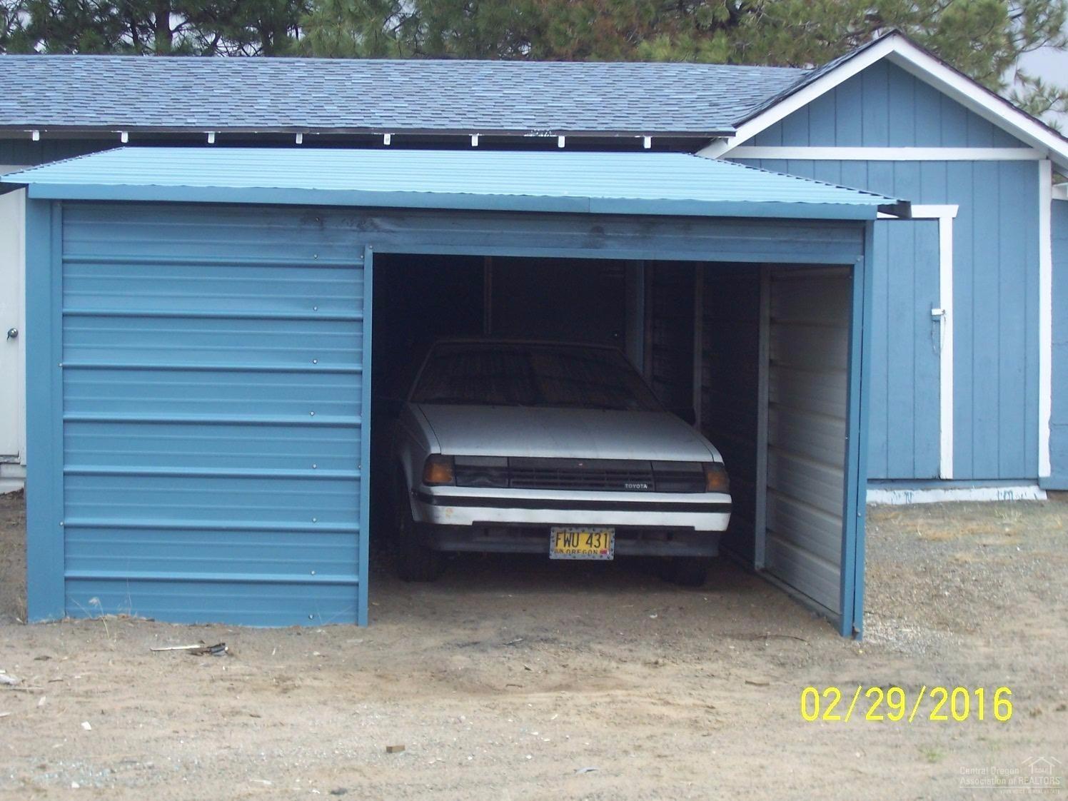 62142 Cody Jr Road Bend, OR 97701 - Photo 12 of 18 Covered parking with storage area and st