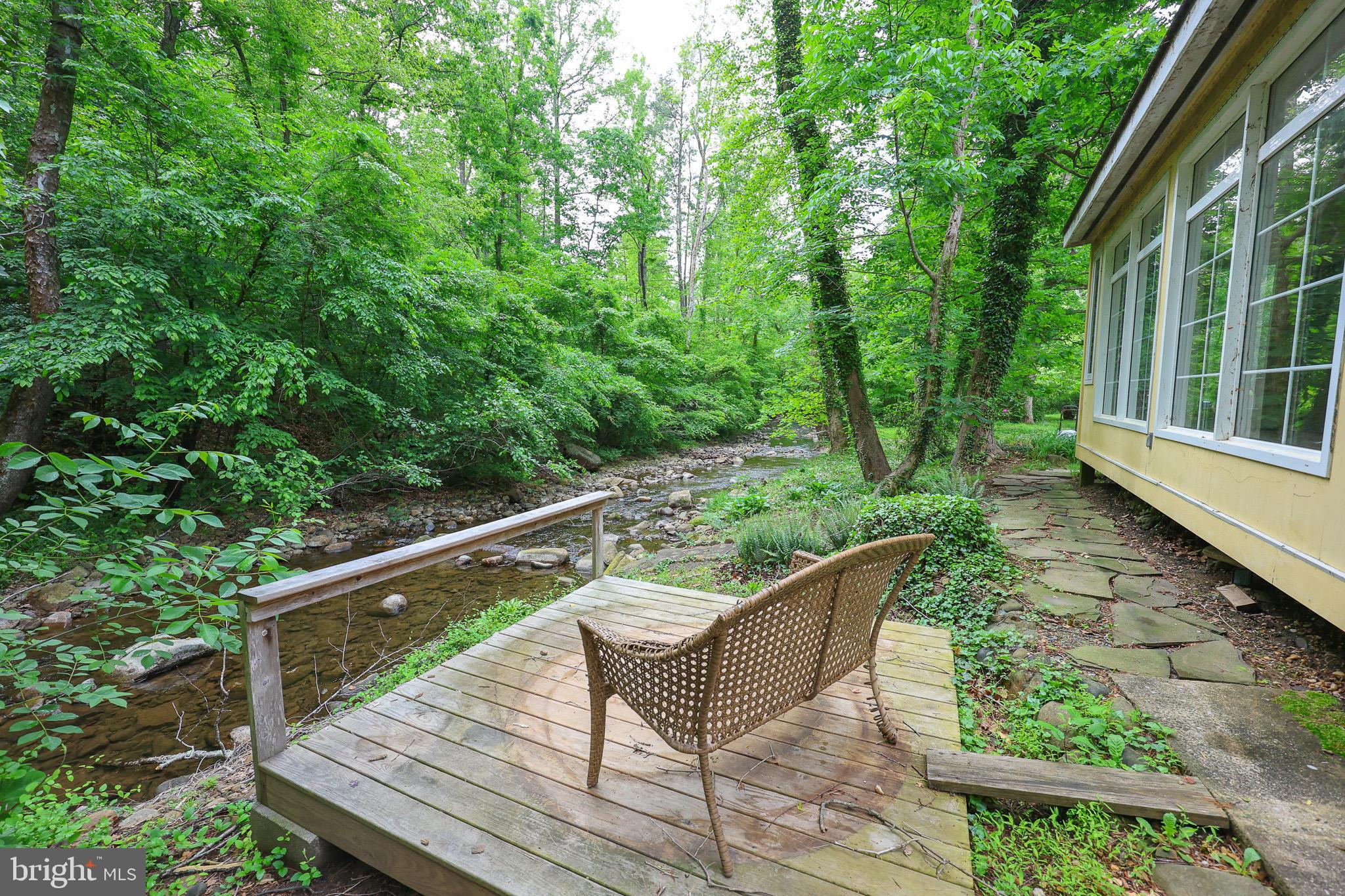 98 Swindler Hollow Road Sperryville, VA 22740 - Photo 19 of 25 a view of a wooden deck with a bench
