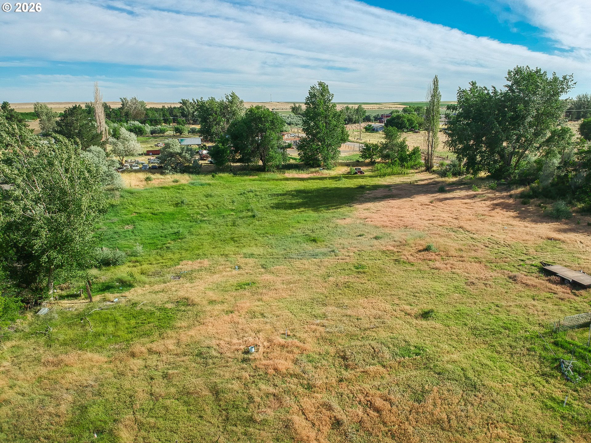 80649 Crooked Road Irrigon, OR 97844 - Photo 20 of 21 a yard with yellow house and green space