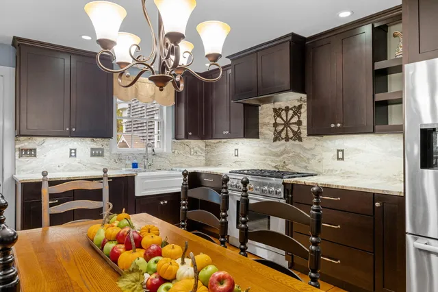 a bedroom with a bed a dresser and a window