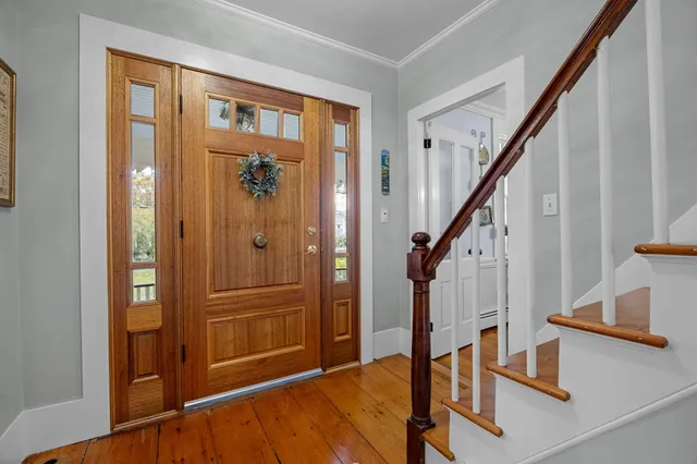 a kitchen with a sink appliances and cabinets