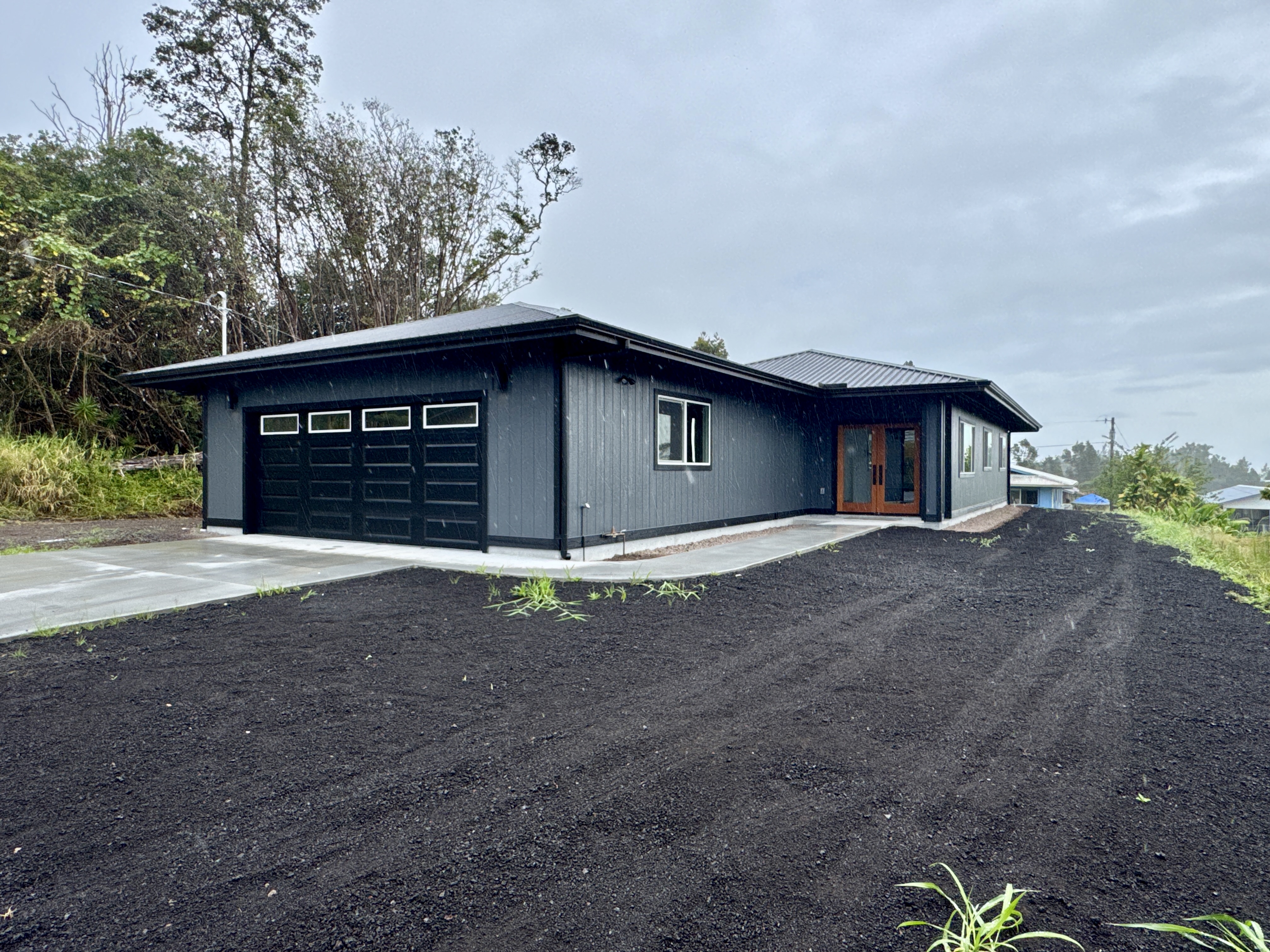 18-7846 Leonaka Road Mountain View, HI 96771 - Photo 1 of 13 a view of a house with a yard