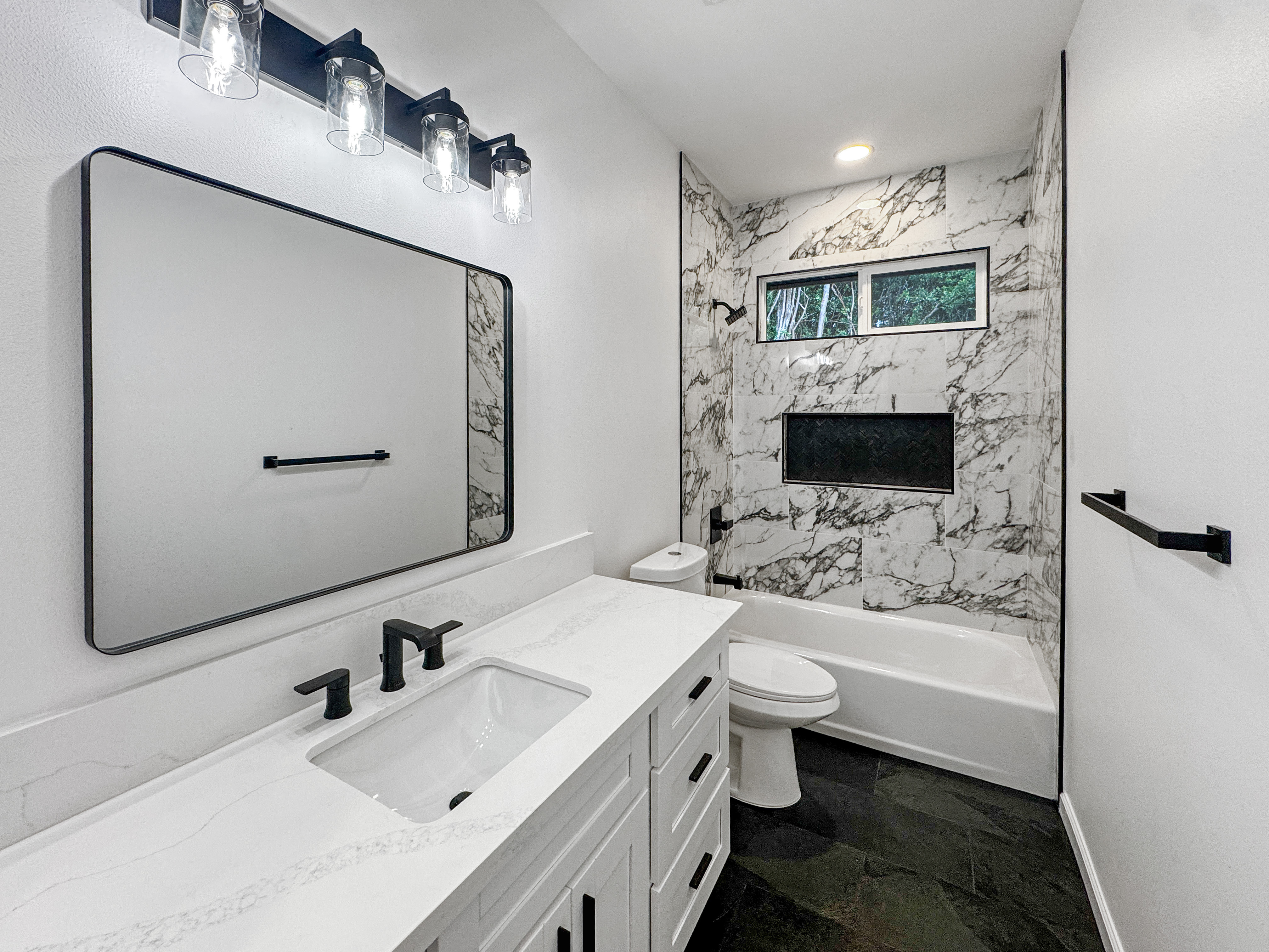 18-7846 Leonaka Road Mountain View, HI 96771 - Photo 5 of 13 a bathroom with a sink a toilet and mirror