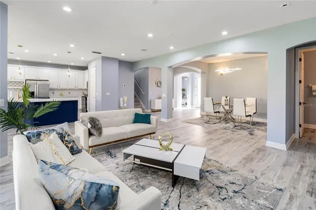 a workspace with furniture and a chandelier