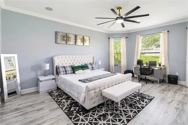 a bed room with a bed and a chandelier