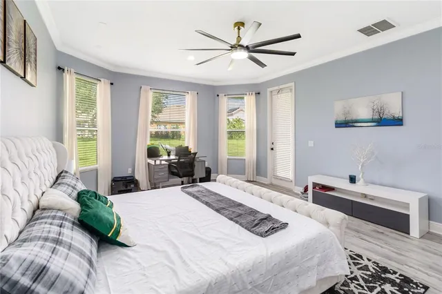 a bathroom with a double vanity sink a mirror and a bathtub
