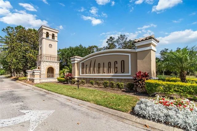 an aerial view of a house with a garden and lake view