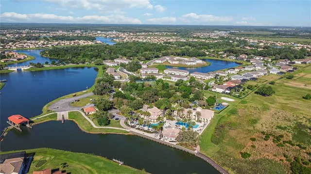 an aerial view of a house with a lake view