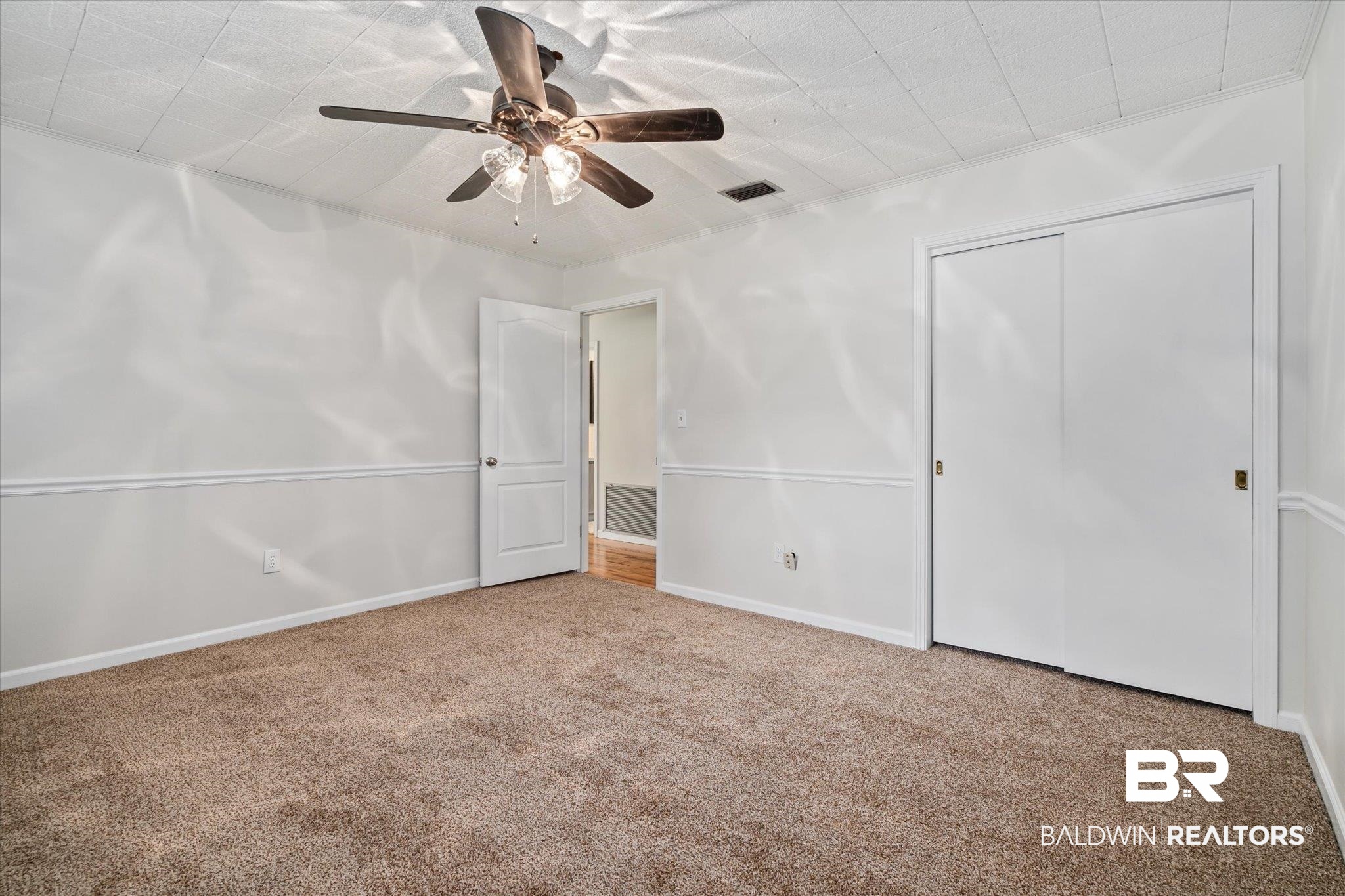 3325 Lacoste Road Mobile, AL 36618 - Photo 12 of 35 Unfurnished bedroom featuring light carpet, ceiling fan, and a closet