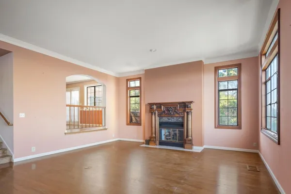 a front view of a house with wooden floor and a window