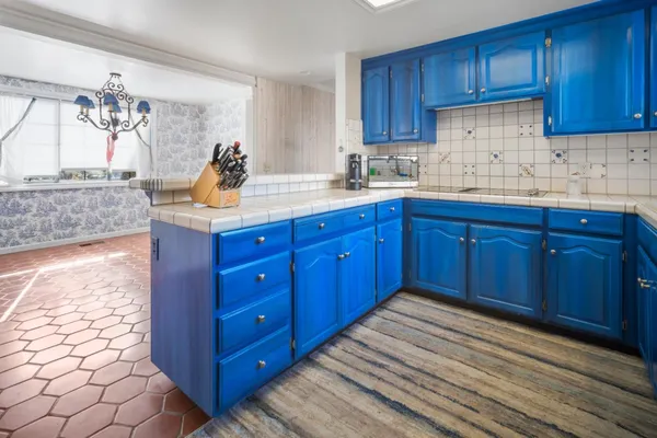 a kitchen with stainless steel appliances granite countertop wooden cabinets a sink and dishwasher