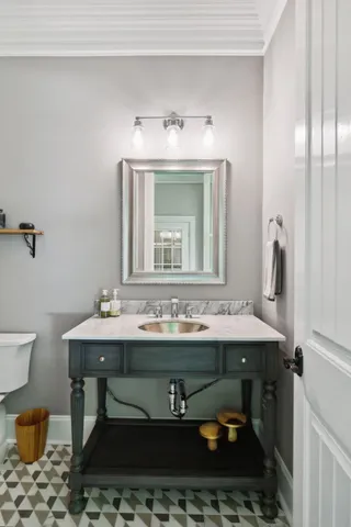 a spacious bedroom with a bed and a lamp