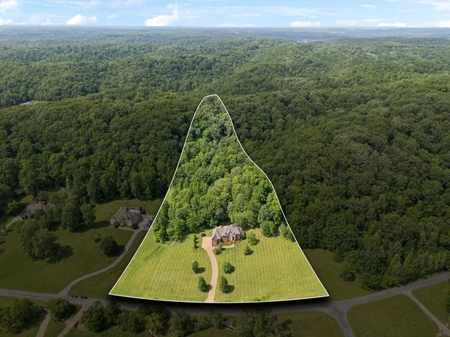 a view of a brick house with a large window